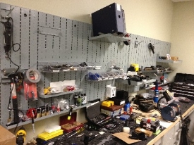 Wall Mountable Weapon Racks storing assorted parts & gear